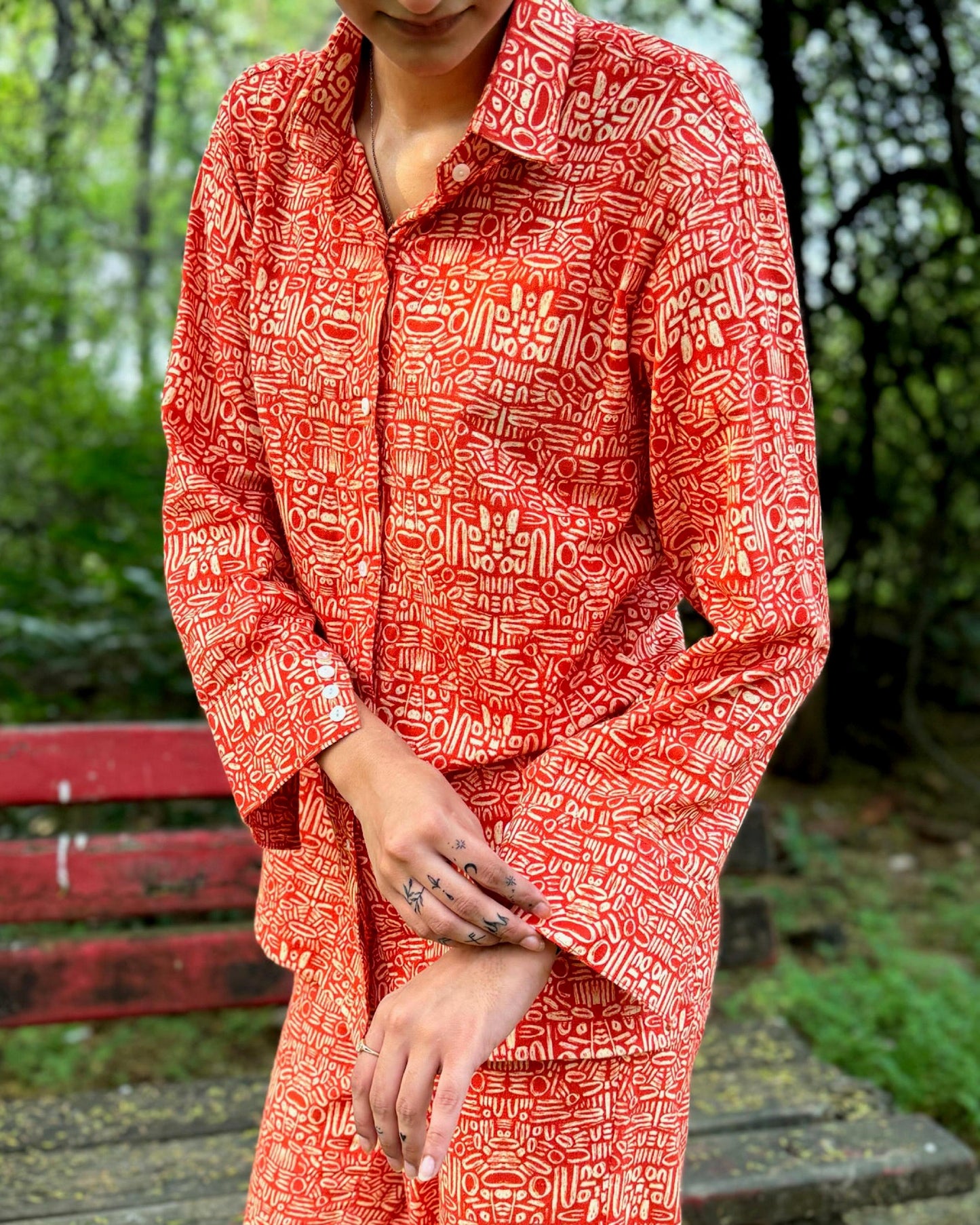 Pacing Around Red Coord Set with Button down Shirt and Straight Pants