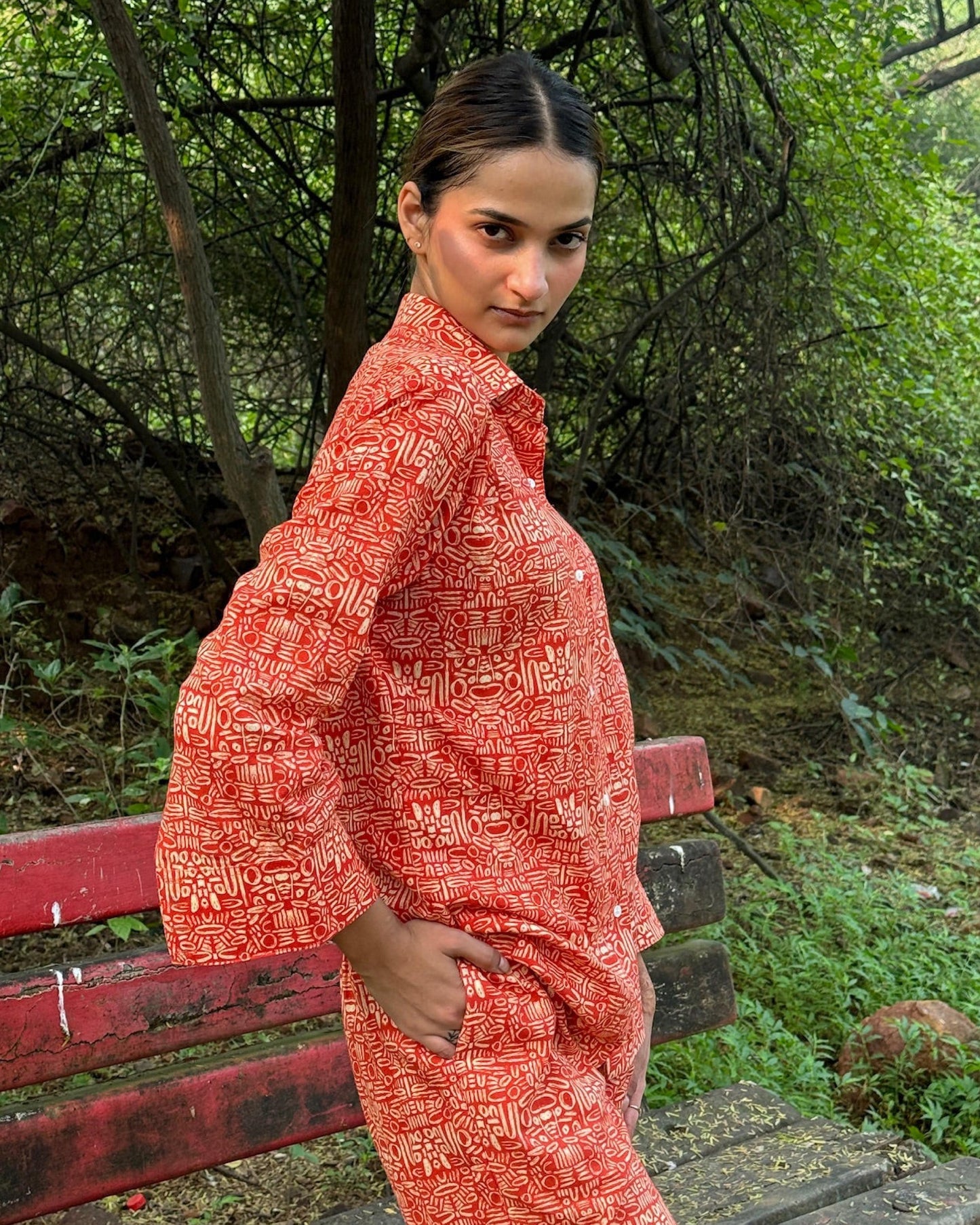 Pacing Around Red Coord Set with Button down Shirt and Straight Pants