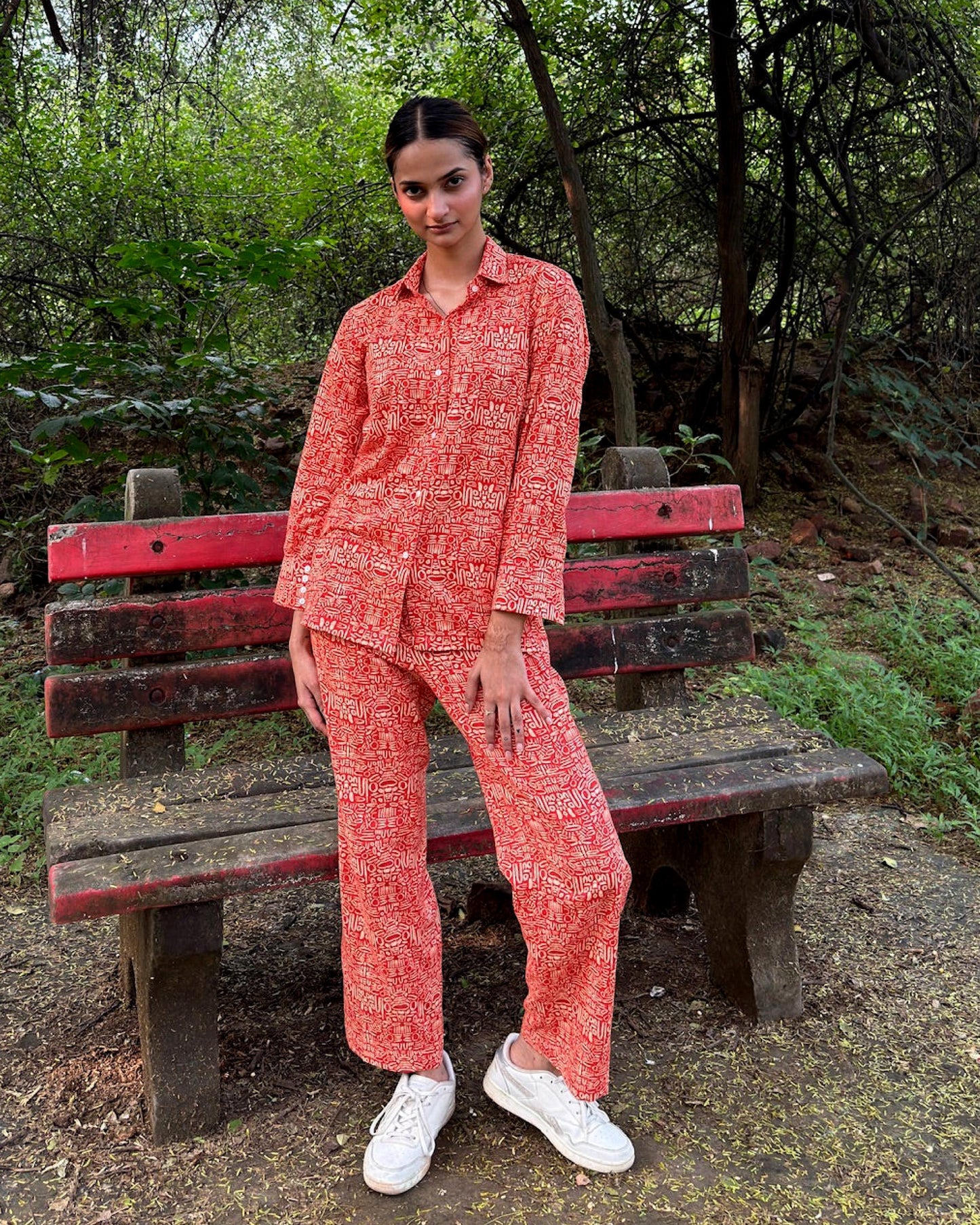 Pacing Around Red Coord Set with Button down Shirt and Straight Pants