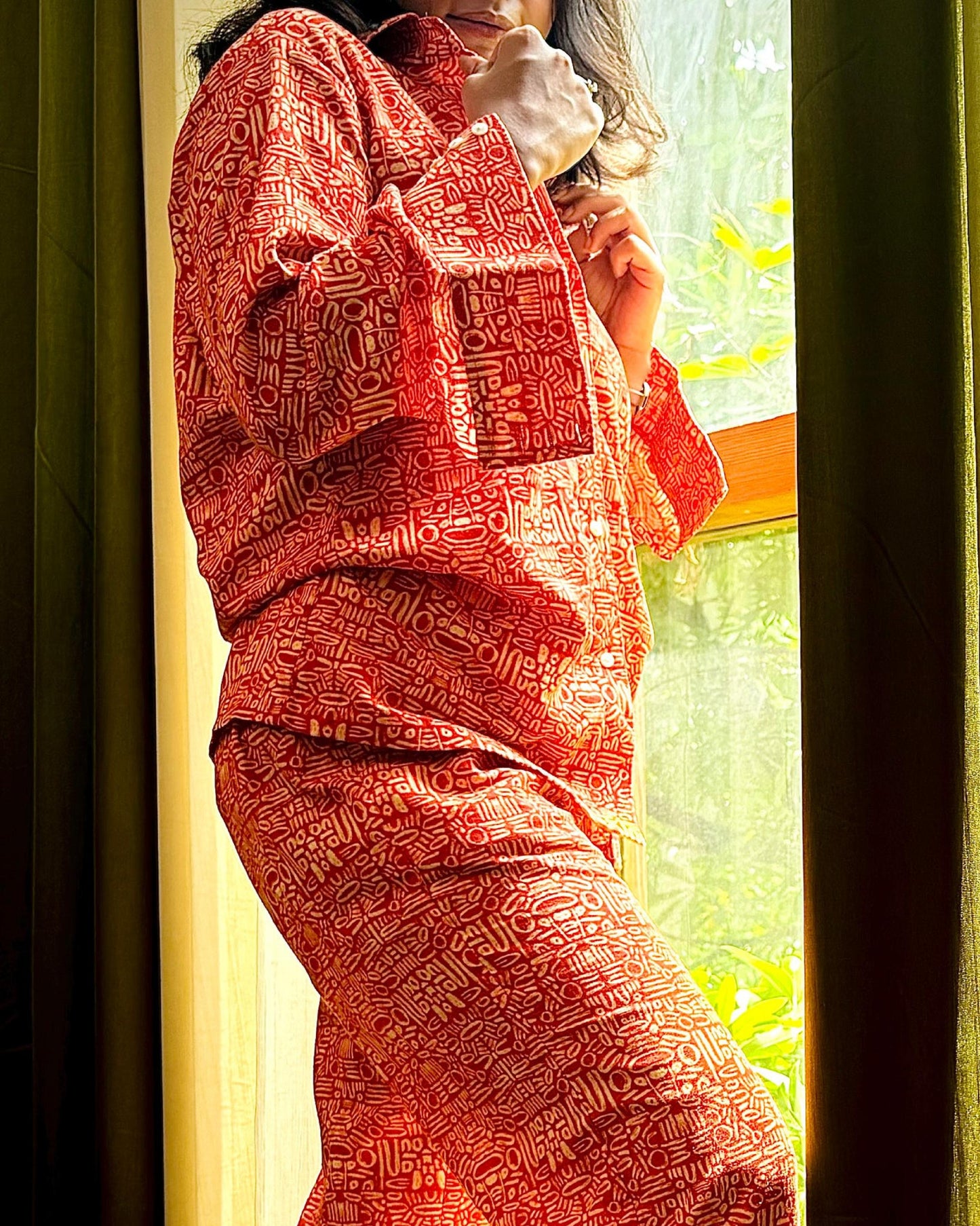 Pacing Around Red Coord Set with Button down Shirt and Straight Pants