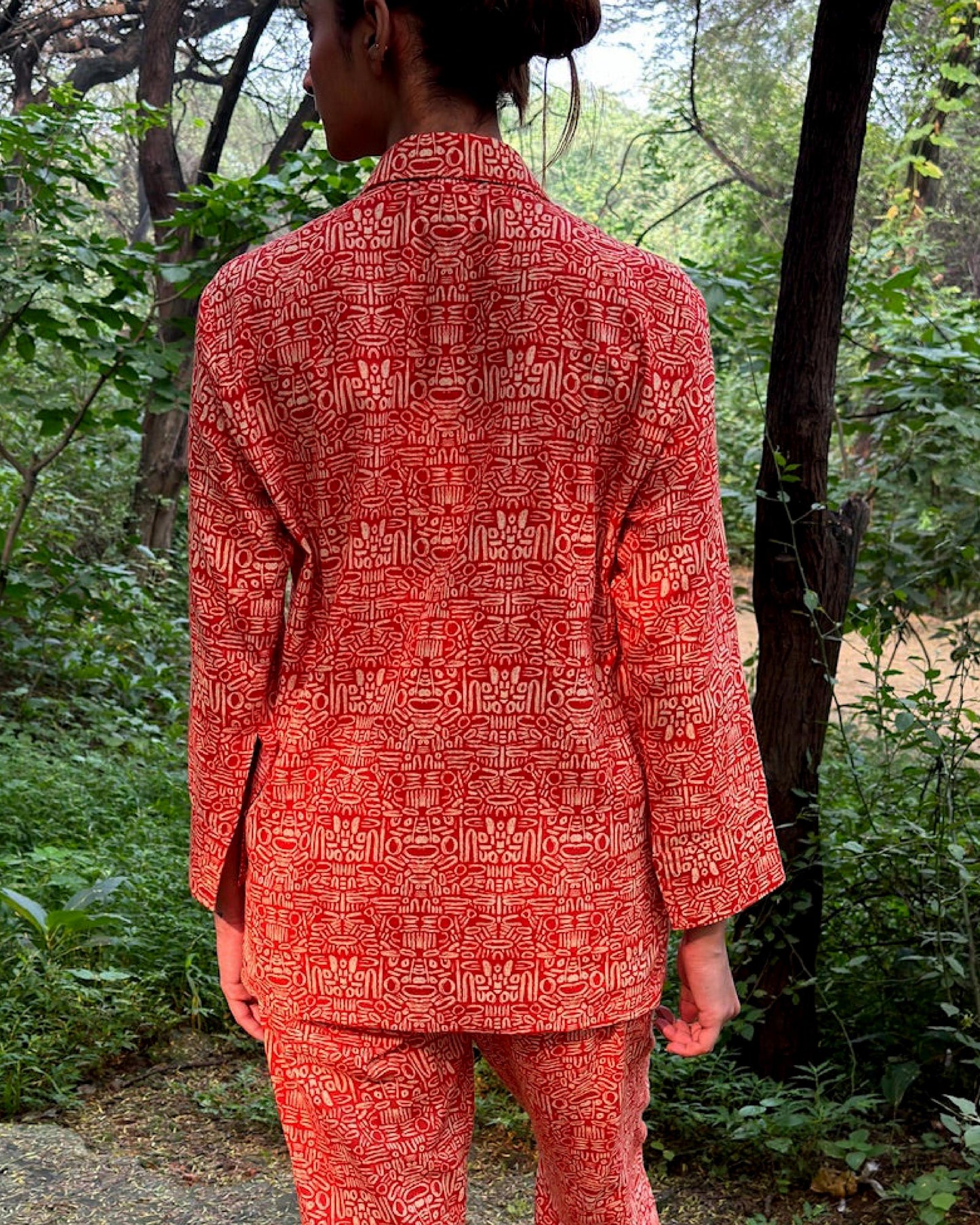 Pacing Around Red Coord Set with Button down Shirt and Straight Pants